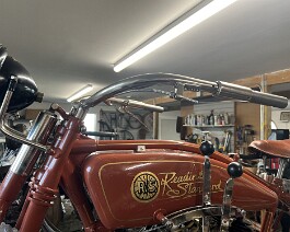 Handlebars with twist grips and all mounting hardware and new nickel plating in place.